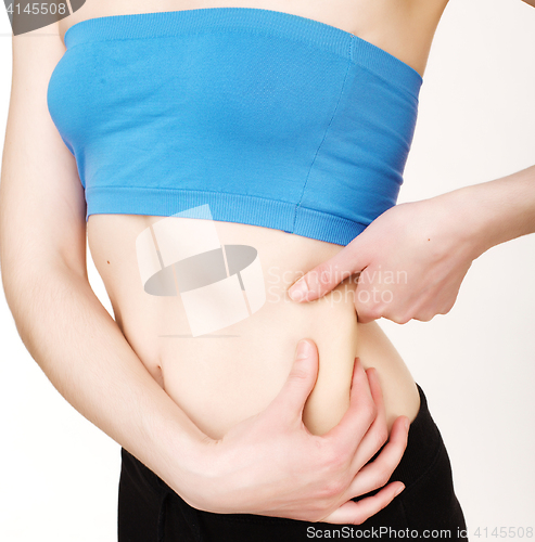 Image of girls stomach measuring with tape isolated on white background, skiny woman on diet, healthcare people concept