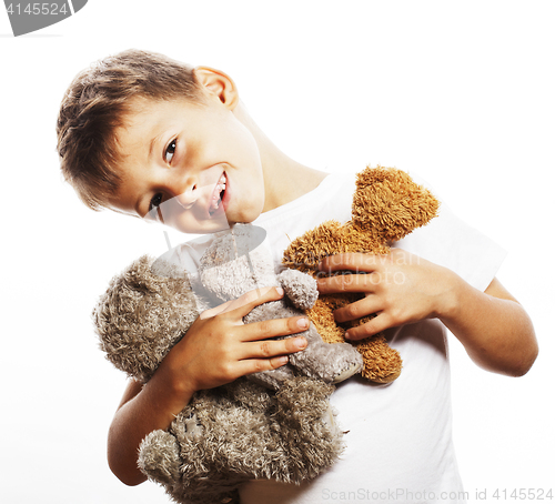 Image of little cute boy with many teddy bears hugging isolated close up