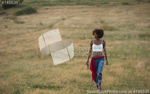 Image of young black woman in nature