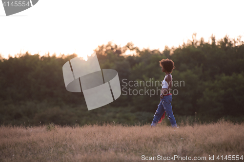 Image of young black woman in nature