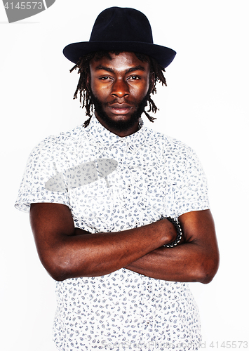 Image of young handsome afro american boy in stylish hipster hat gesturin