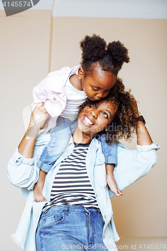 Image of adorable sweet young afro-american mother with cute little daugh