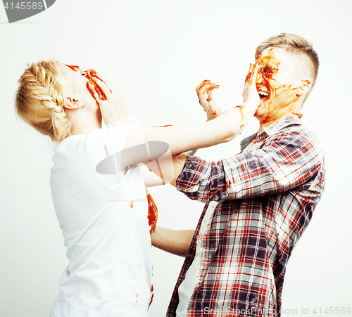 Image of young pretty couple, lifestyle people concept: girlfriend and boyfriend cooking together, having fun, making mess isolated on white background