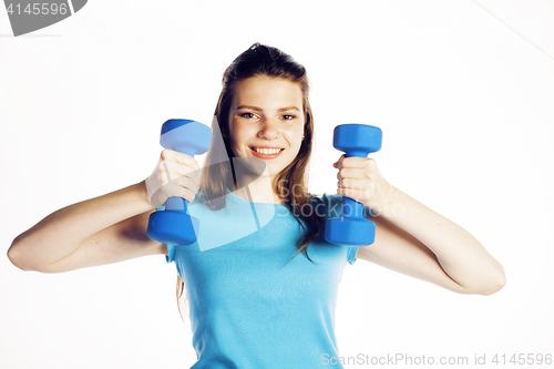 Image of young pretty slim woman with dumbbell isolated cheerful smiling, real sport girl next door, lifestyle people concept