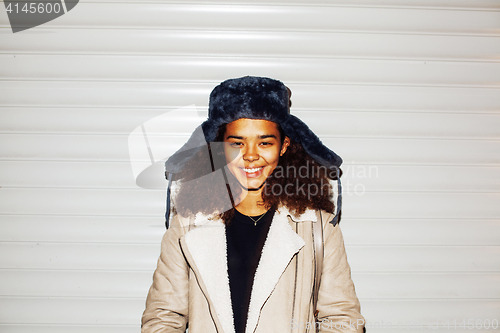 Image of young pretty african american girl teenage outside on street, lo