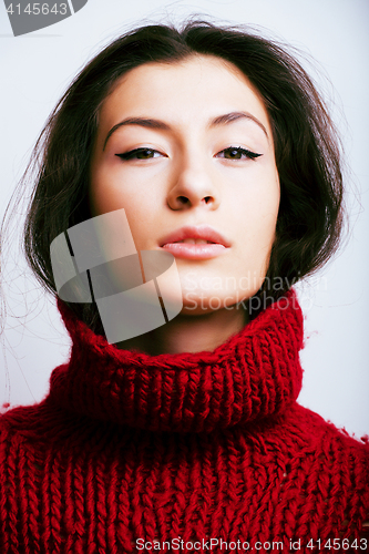 Image of young pretty woman in sweater and scarf all over her face, lifes