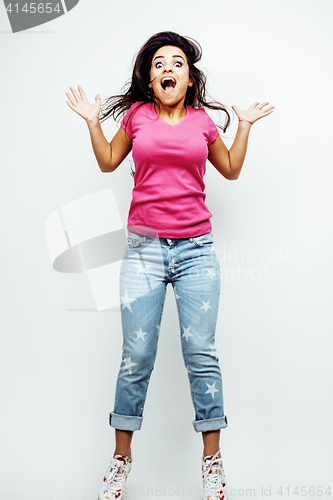 Image of young happy smiling latin american teenage girl emotional posing on white background, jumping flying in joy, lifestyle people concept