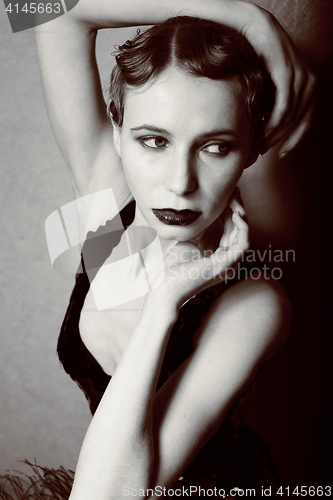 Image of beauty blond woman in studio black and white, old-fashioned hollywood style