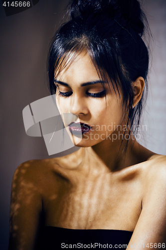 Image of beauty latin young woman in depression, hopelessness look, fashion make up dark style