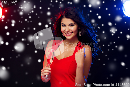 Image of beautiful woman with champagne glass at nightclub