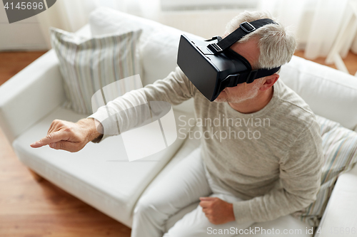 Image of old man in virtual reality headset or 3d glasses