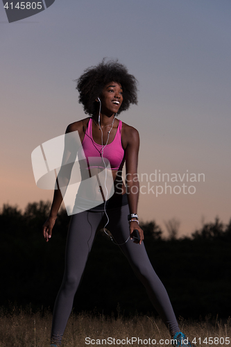 Image of black woman is doing stretching exercise relaxing and warm up