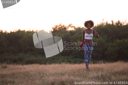 Image of young black woman in nature