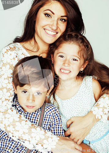 Image of young mother with two children on white background isolated, happy smiling family, lifestyle people concept