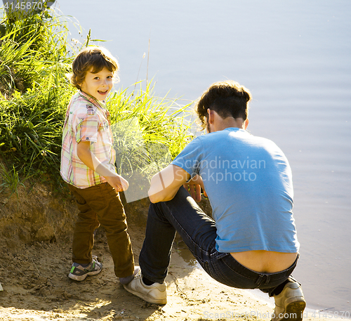 Image of happy smiling little boy with father having fun on summer vacations, lifestyle people concept