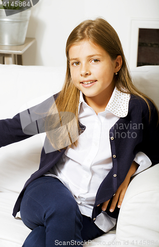 Image of little cute brunette girl at home interior happy smiling close up
