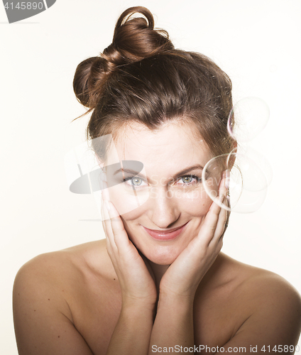 Image of portrait of pretty young brunette woman on white background making bubbles happy smiling, lifestyle people concept