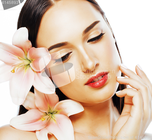 Image of young attractive lady close up with hands on face isolated flower lily tender concept