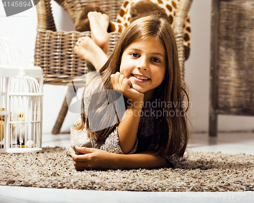 Image of little cute brunette girl at home interior happy smiling close u