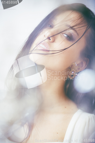 Image of beauty young brunette sad woman close up,real spa hair on face inspiring