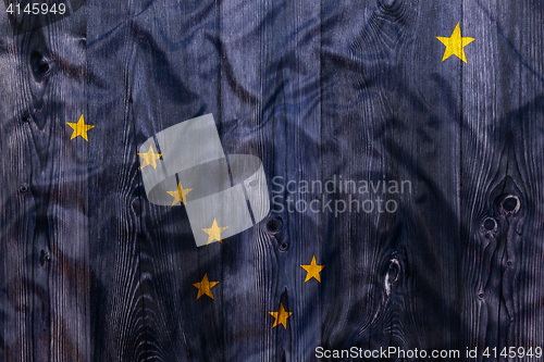 Image of National flag of Alaska, wooden background