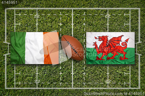 Image of Ireland vs. Wales flags on rugby field