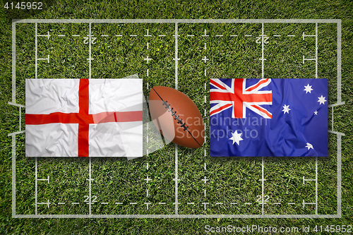 Image of England vs. Australia flags on rugby field