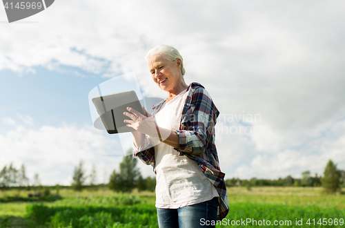 Image of senior woman with tablet pc computer at county