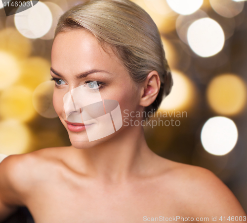 Image of close up of young woman sitting in bath towel