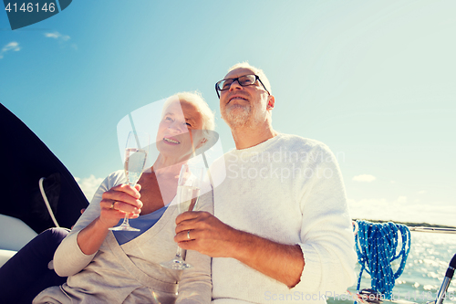Image of senior couple with glasses on sail boat or yacht