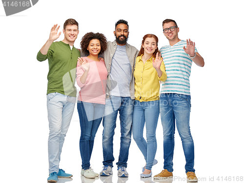 Image of international group of happy people waving hands