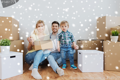 Image of happy family with boxes moving to new home