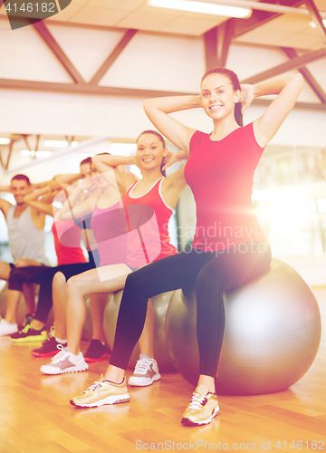 Image of group of people working out in pilates class