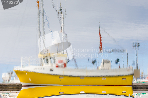 Image of Reflection of a small fishing vessel