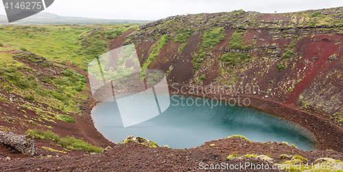 Image of Kerid is a crater lake of a turquoise color - Iceland