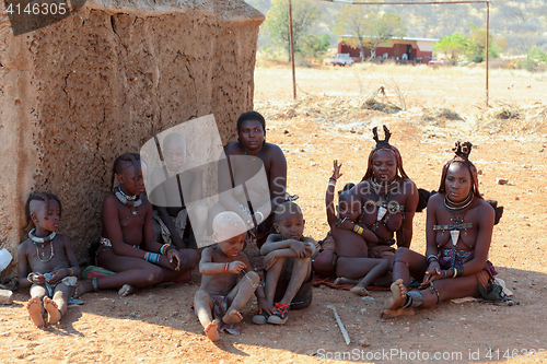 Image of Himba woman with child in the village