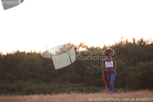 Image of young black woman in nature