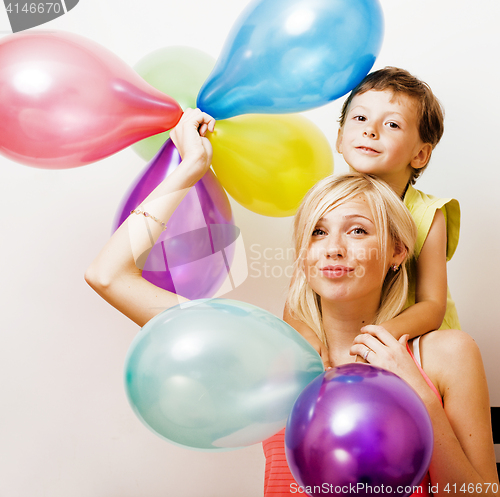 Image of pretty real family with color balloons on white background, blon