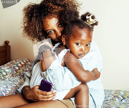 Image of adorable sweet young afro-american mother with cute little daugh