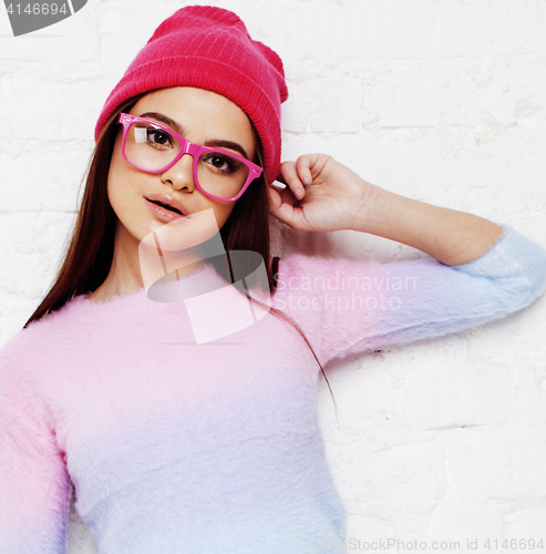 Image of pretty young teenage girl hipster in pink glasses and hat emotional posing happy smiling, lifestyle people concept