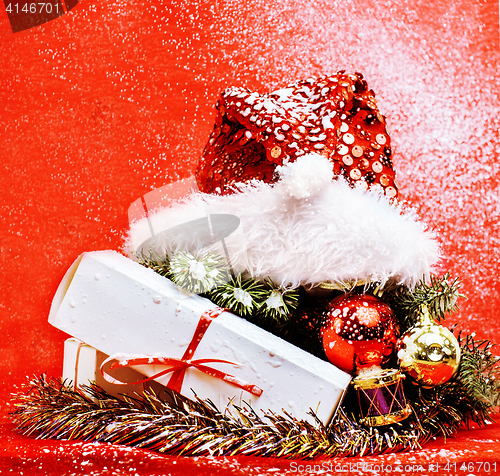 Image of new year celebration, Christmas holiday stuff, tree, toys, decoration with snow isolated, santas red hat