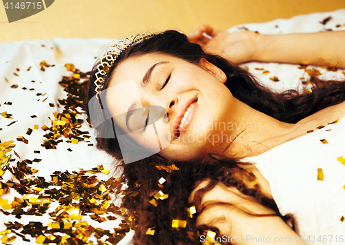 Image of beauty young girl in gold confetti and tiara, little princess celebration hpliday, lifestyle people concept