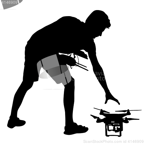 Image of Black silhouette of a man operates unmanned quadcopter illustration