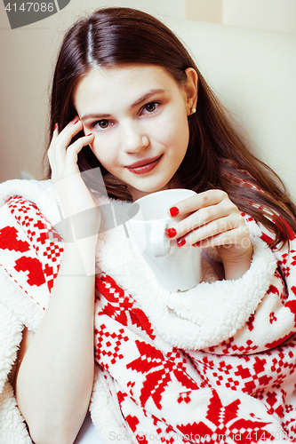 Image of young pretty brunette girl in Christmas ornament blanket getting warm on cold winter, freshness beauty concept, lifestyle people