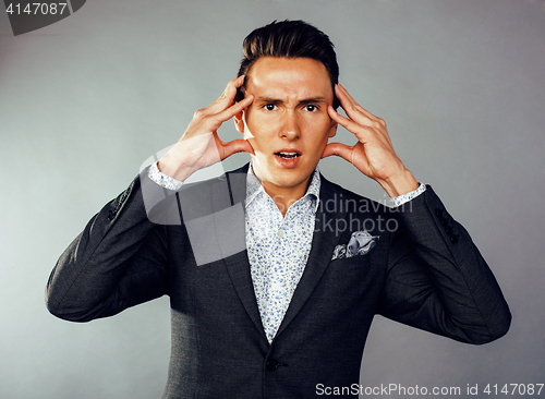 Image of young pretty business man standing on white background, modern hairstyle, posing emotional, lifestyle people concept