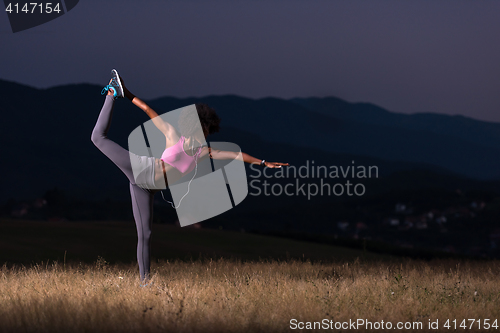 Image of black woman doing yoga  in the nature