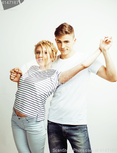 Image of young pretty teenage couple, hipster guy with his girlfriend happy smiling and hugging isolated on white background, lifestyle people concept