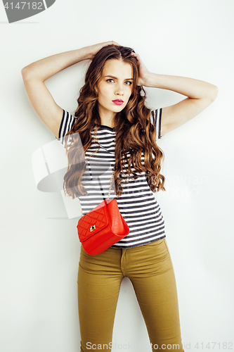 Image of young pretty long hair woman happy smiling isolated on white background, wearing cute tiny handbag, lifestyle people concept