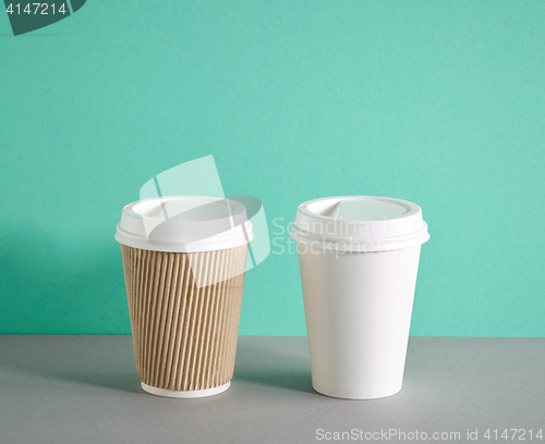 Image of two paper coffee cups