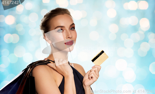 Image of woman with credit card and shopping bags